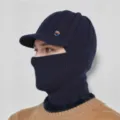 Detail view of the winter warm knitted balaclava cap with visor for men, navy blue. - Navy Blue