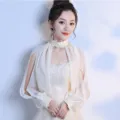 Delicate white chiffon shawl detail, elegant lace stand collar and long sleeves for evening dress. - Champagne