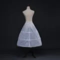White bridal petticoat detail showing waist tie and multi-tier structured steel rings. - Laced Three Steel Rings