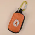 Portable pet waste bag dispenser, lightweight dog poop bag holder with metal carabiner clip. - One Size / Orange