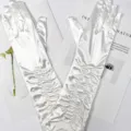 Detailed shot of white satin ruched long gloves, elegant wedding evening etiquette design. - 38cm / Off White