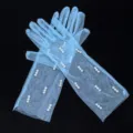 Close-up details of light blue sheer mesh gloves decorated with pearls for kids performance. - Kids One Size / Sky Blue