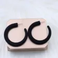 Stylish black chunky hoop earrings, minimalist geometric design for elegant wear. - Arc