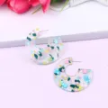 Transparent acrylic C-shaped hoop earrings with colorful confetti flakes and sparkling glitter. - Color 10