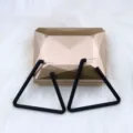 Black geometric triangle stud earrings detail view, minimalist fashion jewelry design. - Triangle