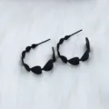 Black heart hoop earrings detail, stylish hollow geometric design for women jewelry. - Concentric C-Hoop