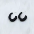 Matte black irregular geometric hoop earrings detail view, minimalist fashion jewelry for women. - Crescent Moon