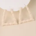 Detail shot of chic beige acrylic triangular bamboo hoop earrings, minimalist design. - Beige