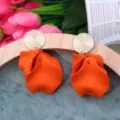 Chic orange petal drop earrings with gold textured disc studs for women summer resort style - Orange