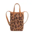 Close-up of a stylish leopard print mini crossbody bag featuring brown leather handles and soft suede. - Leopard Brown