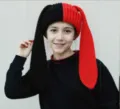 Detail shot of black and red split knit hat with long rabbit ears worn by model. - Elastic (54-58cm) / Red And Black