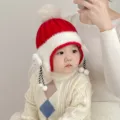 Bonito gorro de punto de invierno rojo para bebés con orejeras y un pompón suave. - 6-48 Meses 44-50cm / Rojo