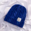 Blue knitted beanie hat with stylish label, warm winter solid color cable knit wool cap SKU. - Blue