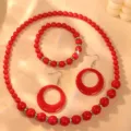 Close-up details of red candy bead jewelry set, featuring acrylic rings and retro necklace. - Red Zirconia Set
