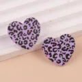 Purple leopard print heart acrylic earrings detail shot, stylish and unique daily jewelry piece. - Black Purple Leopard