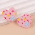 Bonitos pendientes de tuerca de corazon rosa navideño de acrilico con estrellas y cajas. - Estrella Rosa
