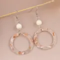 Detail shot of retro leopard print acrylic round dangle earrings, stylish chic jewelry for women. - Milk Coffee