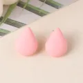 Close-up detail of minimalist pink teardrop acrylic stud earrings, simple elegant design. - Pink