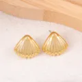 Gold seashell stud earrings detail view, showing delicate metal ribbed texture and elegant design. - Shell / Gold