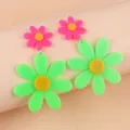Close-up detail of fluorescent acrylic flower earrings, vibrant double-layer design for women. - Green
