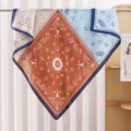 Chic 90cm square silk scarf featuring a vintage paisley patchwork and Eiffel tower design. - Two-Tone Paisley Orange