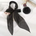 Close-up details of black polka dot ribbon silk scarf and elegant rose flower accessory. - Scarf with Rose / Black with Small Polka Dots