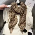 Detailed shot of brown leopard print long silk scarf, versatile hair ribbon or neck accessory. - Coffee Leopard Silk Scarf