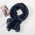 Detailed view of women's dark blue floral crinkle voile scarf, soft fabric texture close-up. - Floral Pleated Style 2 Navy Blue