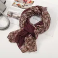 Detail view of lightweight floral patchwork scarf, showing soft texture and rich maroon color. - Floral Pleated Style 4 Burgundy Beige