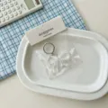Ciondolo portachiavi con fiocco in acrilico trasparente per borsa accessorio moda - Bianco