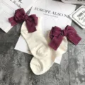 Japanese cute style cotton socks with large dark red bows and rolled cuffs for women. - One Size / Milky White + Red Bowknot