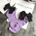 Cute purple cotton socks for women featuring large black bowknot decor and rolled edge design. - One Size / Light Purple + Black Bowknot