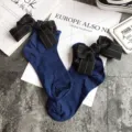 Japanese sweet style dark blue cotton socks for women with large black ribbon bow and rolled edge. - One Size / Navy Blue + Black Bowknot