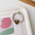 Sweet satin hair scrunchie with cute tulip heart charm and lovely bear detail for daily wear. - Beige Scrunchie + Brown Tulip Cloth Label