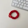 Red velvet hair scrunchie with festive embroidered tag, stylish hair accessory for women. - Large Scrunchie - Supreme Beauty