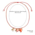 Resort style red braided rope necklace featuring metal fish, starfish and shell charms. - Island Shell (N2409-34)