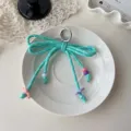 Cute woven bow keychain with colorful beads, stylish dopamine bag charm for women and girls. - Lake Green