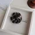 Elegant tweed camellia brooch with metal number five and crystals for chic vintage style. - Thickened Coffee Floral + Number 5 Brooch