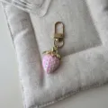 Cute pink strawberry keychain pendant, glossy resin charm with gold tone hardware for bags. - Solid Pink Strawberry