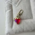 Cute gradient red strawberry keychain, stylish gold metal bag charm and key pendant accessory. - Transparent Red Strawberry