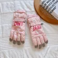 Close-up detail of pink winter ski gloves featuring waterproof fabric and touchscreen fingertips. - One Size / Pink