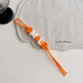 Orange braided bag charm with colorful letter beads spelling smile, cute accessory. - Orange SMILE