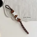 Chic brown woven rope keychain with colorful letter beads spelling smile for bags. - Coffee SMILE