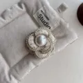 Elegant tweed camellia brooch with central pearl and gold trim for women clothing accessory - Three-Petal Beige Sequin Brooch