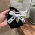 Black crochet earphone case with white lace bow and heart pendant, plush mini coin storage pouch. - White Lace Bow