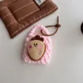 Handmade knitted mini earphone bag with pink plush cartoon charm for cute daily styling - Carrot