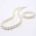 Elegant white pearl necklace and bracelet set with silver clasp for stylish everyday wear. - White