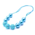 Blue resin rhinestone ball children necklace detail close up view, cute fashion accessory. - Blue