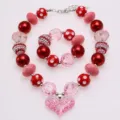 Set collana e bracciale per bambine con ciondolo a cuore glitter rosa e perline rosse - Set