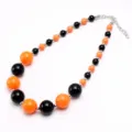 Kids chunky acrylic bead necklace in bright black and orange Halloween style jewelry. - Black & Orange